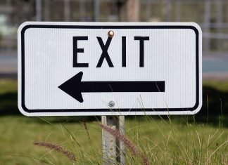 exit sign to represent FTSE quarterly reviewing demoting companies from an index
